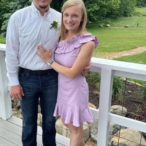 Purple short cocktail dress. Purchased from dry goods and wore to one wedding.